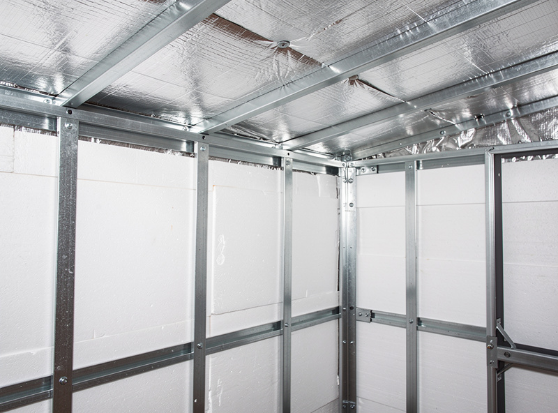 Rigid foam polyiso insulation panels installed on the inside walls and roof of a metal chicken coop