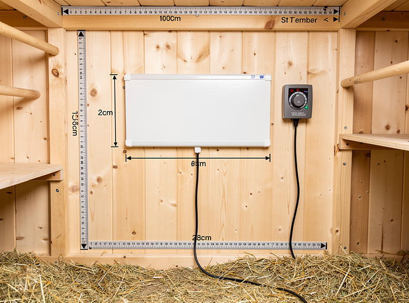 Flat panel chicken coop heater on thermostatic outlet with safety clearances marked